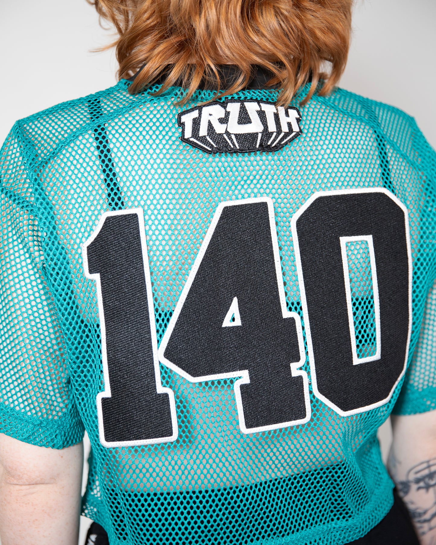 TEAL MESH CROP TOP JERSEY