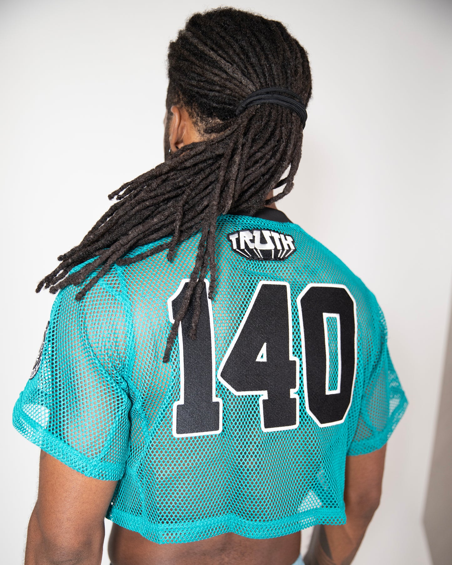 TEAL MESH CROP TOP JERSEY